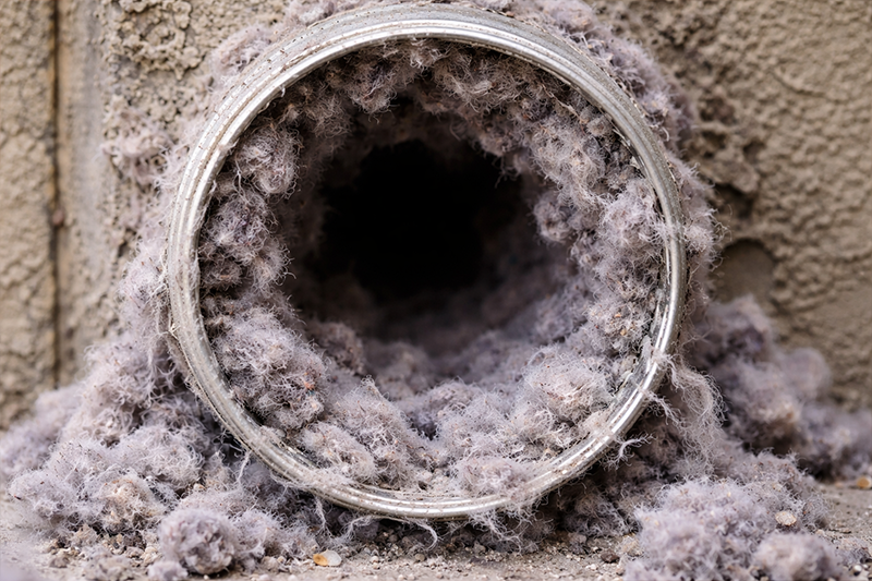dirty dryer vent clogged with lint buildup